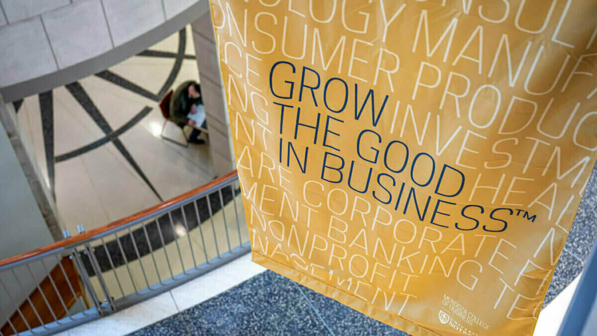 Grow the Good in Business banner hanging over the Mendoza first floor atrium.