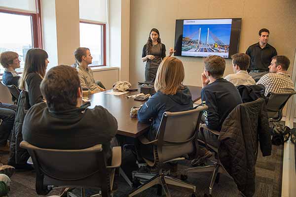 Students listen to HNTB presenter Allison Halpern and Patrick D'Ambrosio (right) at the Empire State Building.